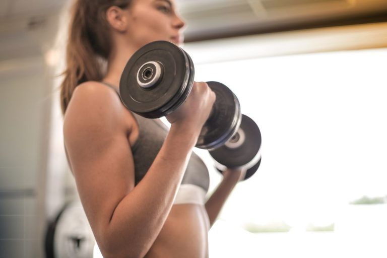 Woman Doing Dumbbell Curls