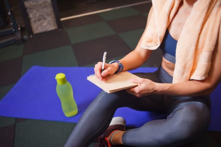 Woman in Fitness Outfit Planning